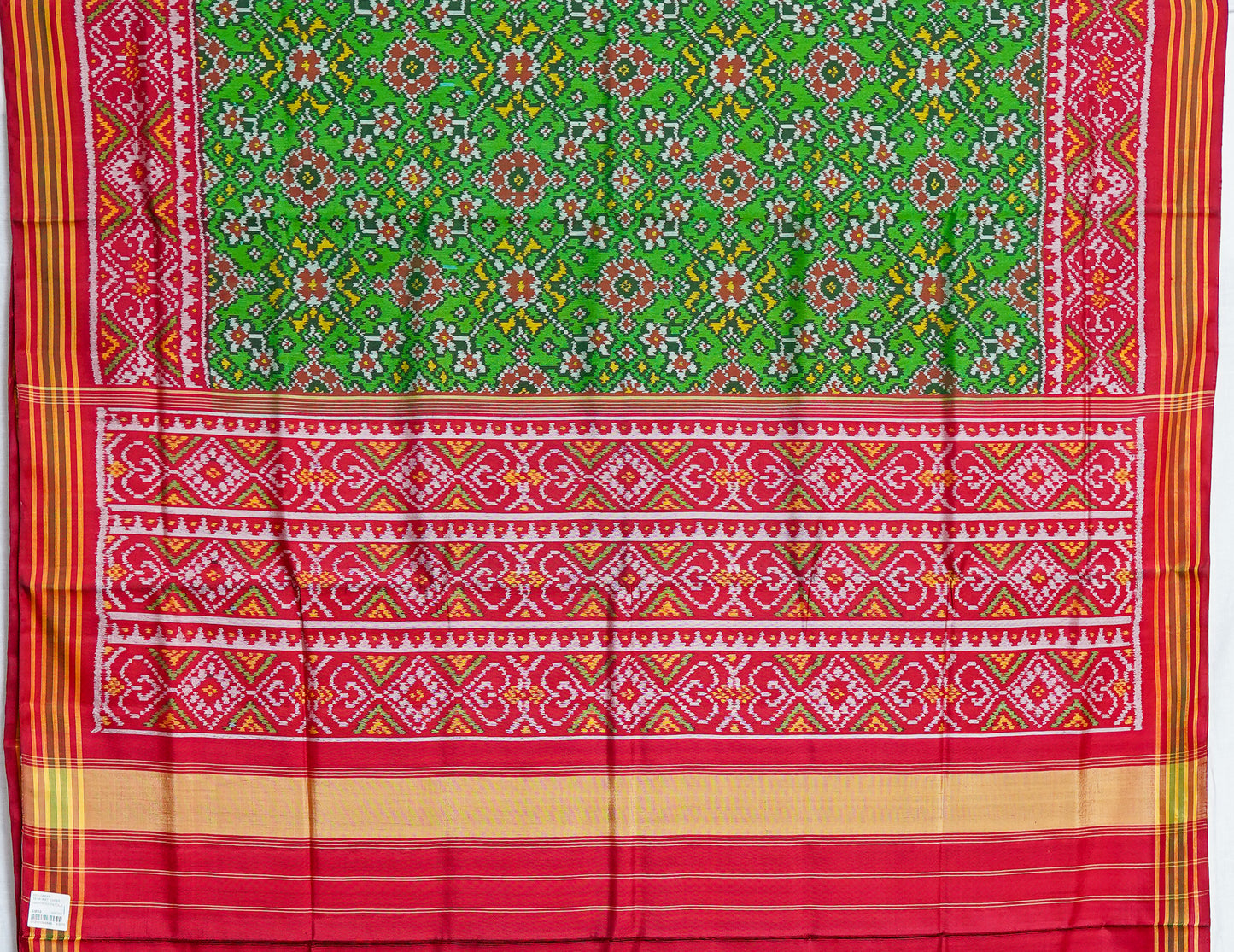 light green patan patola saree with red border – traditional double ikat elegance
