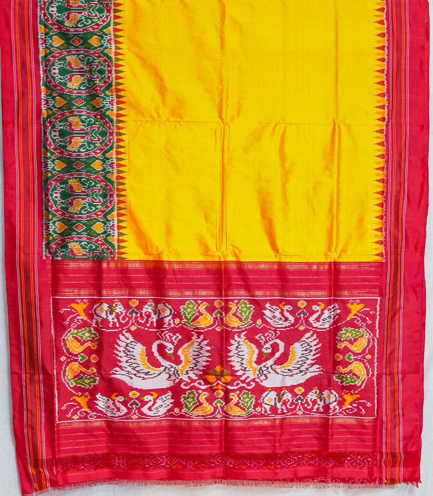 yellow patan patola saree with green & red accents – handwoven heritage weave